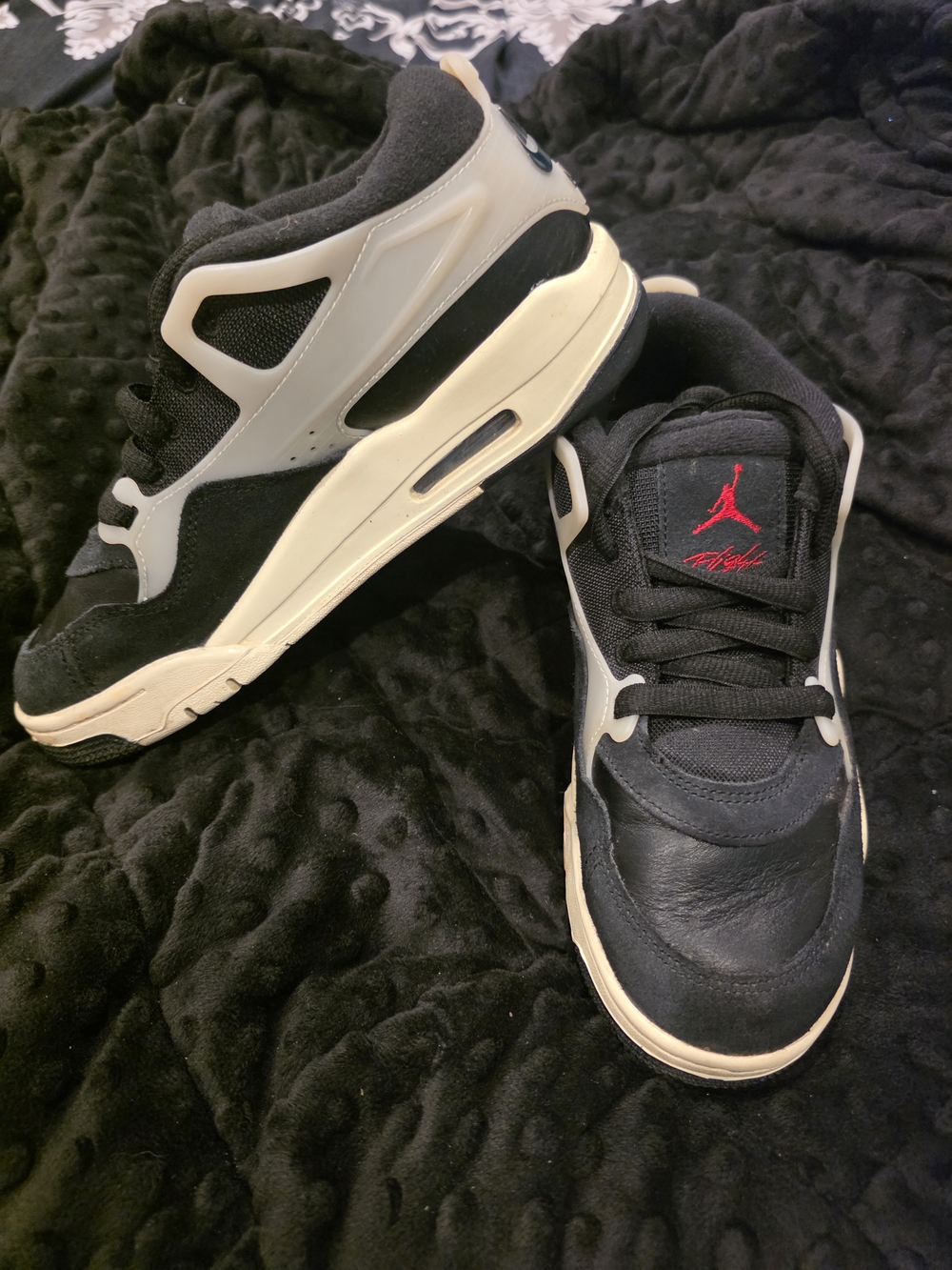 Air Jordan 4 RM (RemIX) in the "Black Sail" colorway.